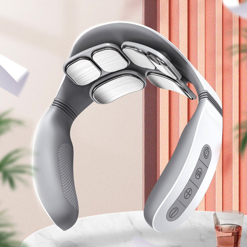 Neck and shoulder massager with six contact pads, resting on a table