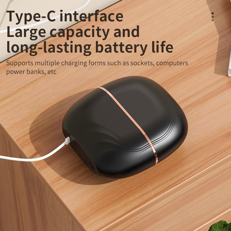 Black mini straightening comb charging through its USB-C port