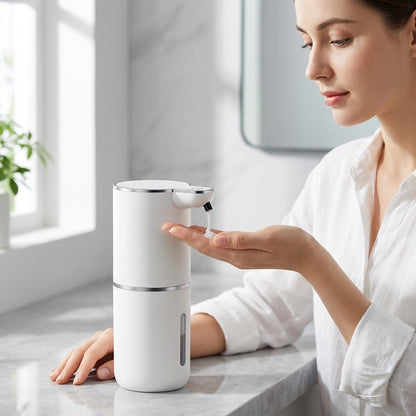 Woman using a white soap dispenser on a marble countertop.